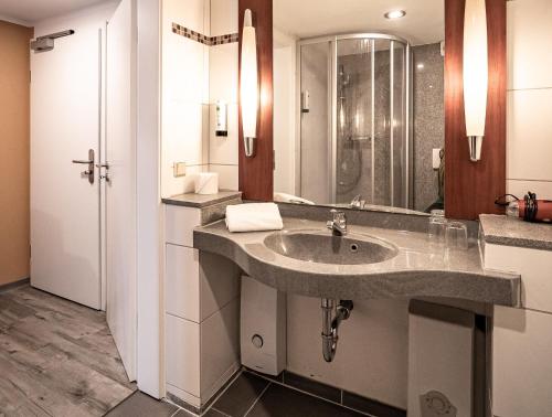 Ванная комната в Le petit Palais - Hotel/Pension