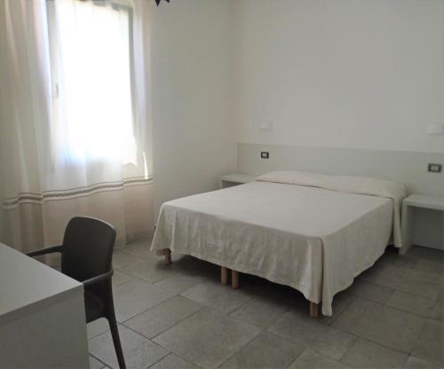 Postel nebo postele na pokoji v ubytování B&B da Rosella