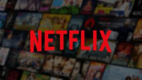 a red netflix sign on a bunch of magazines at Villa Le Jardin in Oude Pekela
