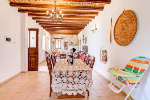a dining room with a table and chairs at Sermar Villa in Episkopi Pafou