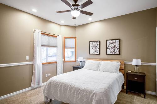 a bedroom with a bed and a ceiling fan at Dayton Retreat in Dayton