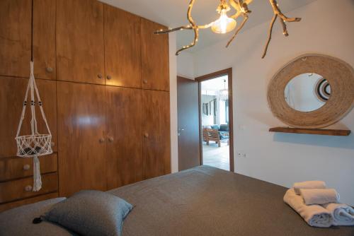Postel nebo postele na pokoji v ubytování Chrisambelos Apartments