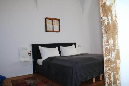 Ein Bett oder Betten in einem Zimmer der Unterkunft Hotel im Stift Neuberg