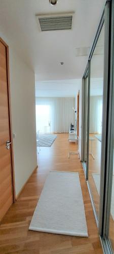 a living room with a white rug on the floor at Seedri Breakwater Residence in Pärnu