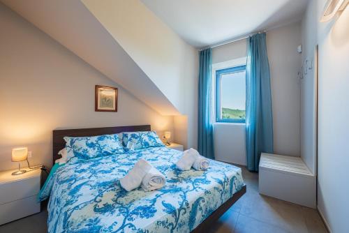 Ένα ή περισσότερα κρεβάτια σε δωμάτιο στο Il Ciuchè Apartments