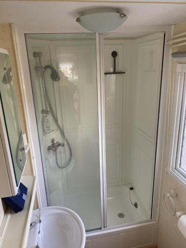a bathroom with a shower and a sink at RBR 232 - Beach Resort Kamperland in Kamperland