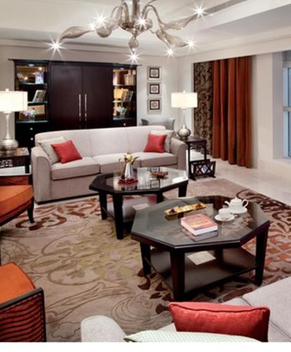 a living room with a couch and a table at Makkah Clock Royal Tower, A Fairmont Hotel in Makkah