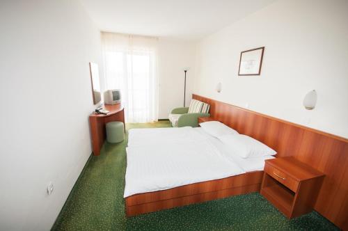 Postel nebo postele na pokoji v ubytování Hotel Lavanda