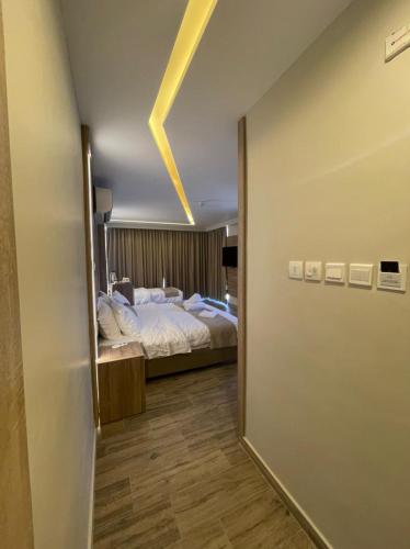 Postel nebo postele na pokoji v ubytování ALENA HOTEL