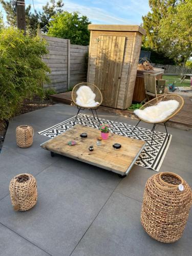a patio with a table and two chairs and a table and chairs at La Souricière in Silenrieux