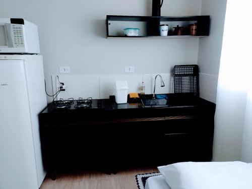 Dapur atau dapur kecil di Kitnets bem localizada, próx ao autódromo!