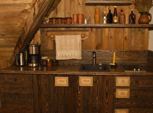 a kitchen with a sink and a counter in a cabin at Vastseliina Piiskopilinnus 