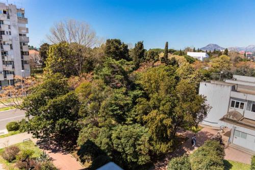 an overhead view of trees in a city at La Costa Apartments in Bar