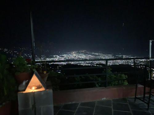 a view of a city at night at Hotel Pristine Himalaya in Pokhara