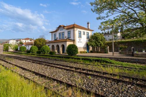 a house with a train tracks in front of it at Quinta De Fundevila -quinta privada in Cabeceiras de Basto