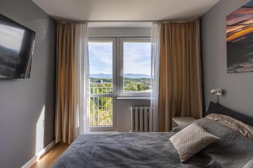 Posteľ alebo postele v izbe v ubytovaní Apartament TOP FLOOR
