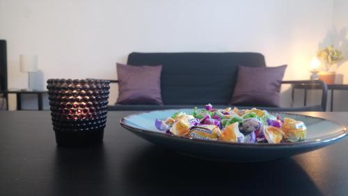 a plate of salad sitting on a table at Sziget Apartman in Eger