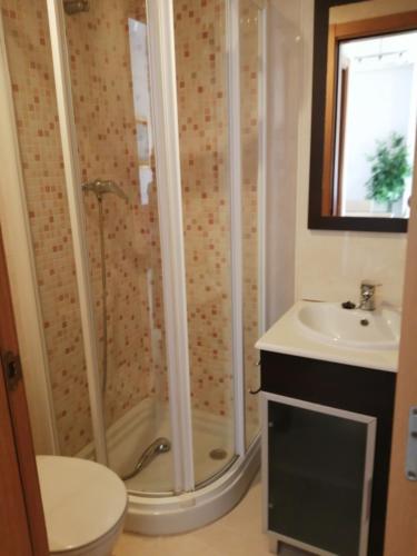 a bathroom with a shower and a sink at Magic World Aguamarina in Oropesa del Mar