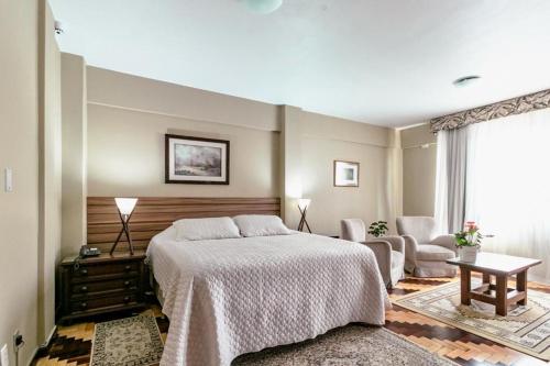 Ένα ή περισσότερα κρεβάτια σε δωμάτιο στο Hotel San Rafael