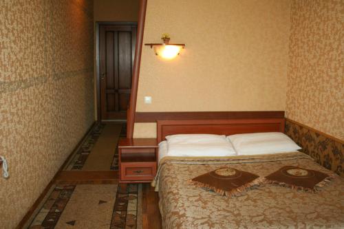 Llit o llits en una habitació de Don Kihot Hotel