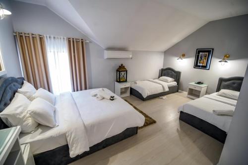 Postel nebo postele na pokoji v ubytování Univers Resort