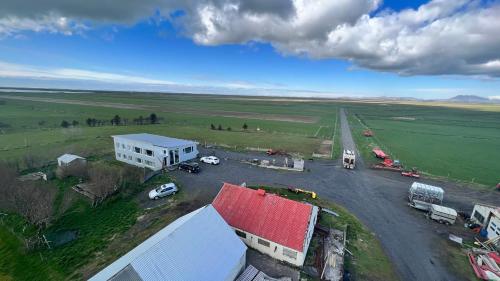 an aerial view of a parking lot in a field at Bakland ad Lágafelli Apartment in Búðarhólshverfi