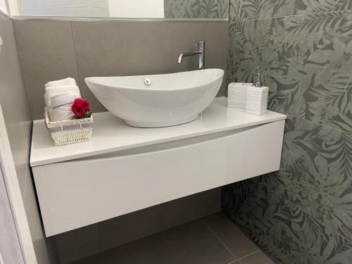 a bathroom with a white bowl sink on a counter at Abate Filippo apartment in Nardò