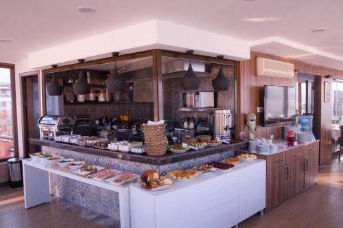 A kitchen or kitchenette at Kerimbey Hotel