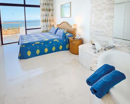 Postel nebo postele na pokoji v ubytování Anfi del Mar - Apartament mit Meerblick