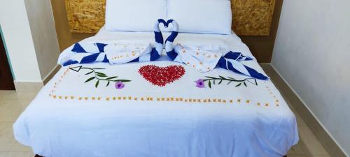 Letto o letti in una camera di La Isla Tropica