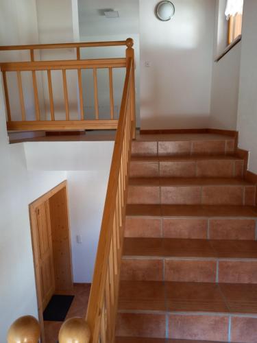 a staircase leading up to the second floor of a house at Nagelehof 3 in Ainet