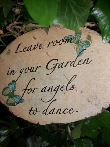 a sign that reads leave room in your garden for angels to dance at The Feathers Shepherds Hut in Áth Eascrach