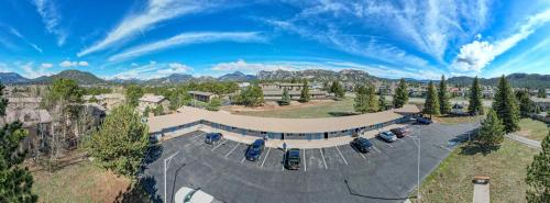 an aerial view of a building with cars parked in a parking lot at Columbine Inn in Estes Park