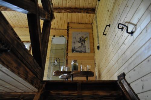 a view of a bathroom in a wooden cabin at Willa na Drzewie in Rudka Gołębska