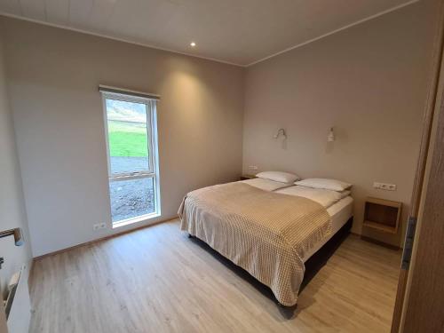 Postel nebo postele na pokoji v ubytování Krákhamar Apartments