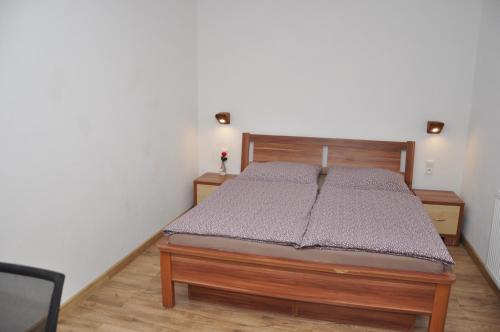 Posteľ alebo postele v izbe v ubytovaní MW Apartman