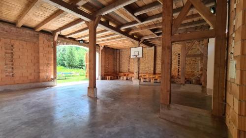 an empty room with a basketball hoop in a building at Statek Kopanina in Kopanina