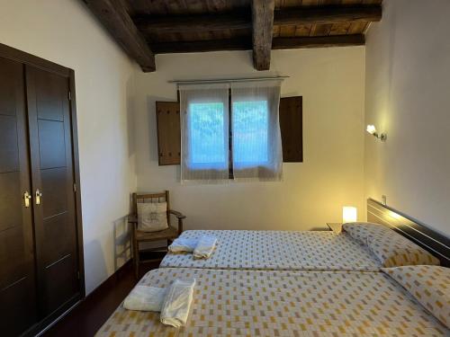 A bed or beds in a room at Apartamentos Rurales En Plena Sierra