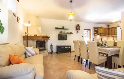 a living room with a kitchen and a dining room at Gorgeous Home In Cabrunici With Wifi in Čabrunići