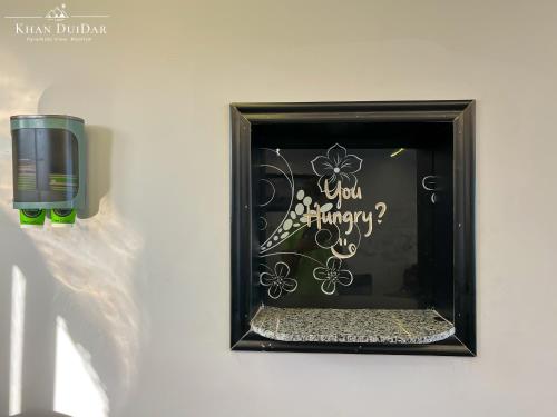 a picture of a window with a sign that says you happy at Khan Duidar Inn - Pyramids View Rooftop in Cairo