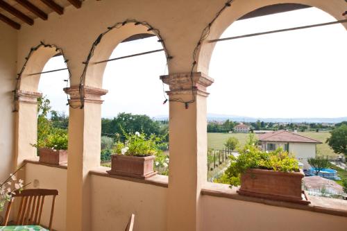 Un balcon sau o terasă la Casa Castellina