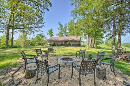 a group of chairs sitting around a fire pit at Relaxing Rural Harrison Home - 11 Mi to Town in Harrison