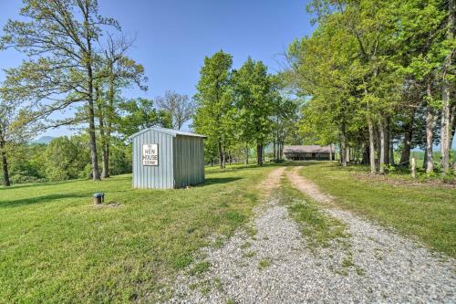 a small shed in a field with a dirt road at Relaxing Rural Harrison Home - 11 Mi to Town in Harrison
