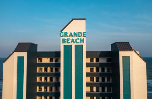 a hotel with the words grande beach on top of it at Grande Beach Resort in Myrtle Beach
