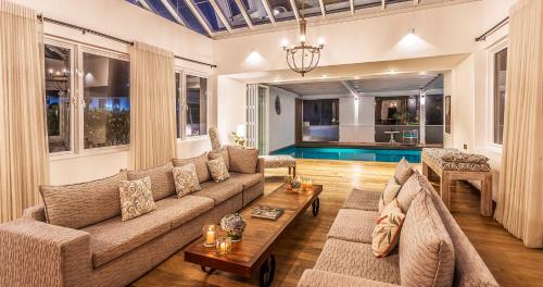 a living room with a couch and a table at W15 Lake Gregory in Nuwara Eliya