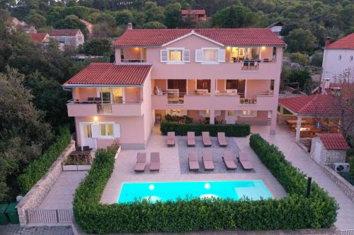 an aerial view of a house with a swimming pool at Apartments BoBo in Kraj