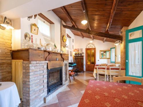 a living room with a fireplace and a dining room at Holiday Home in Guardavalle near River in Guardavalle