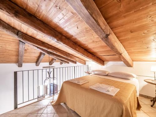 a bedroom with a bed in a room with wooden ceilings at Holiday Home in Guardavalle near River in Guardavalle
