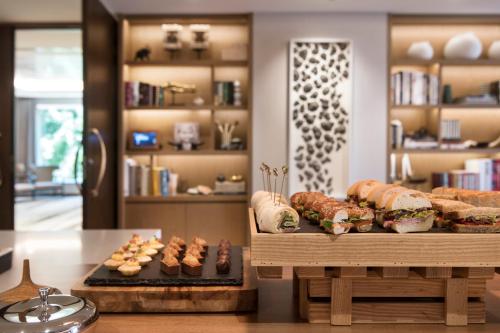 a bakery with several different types of sandwiches and pastries at InterContinental Perth City Centre by IHG in Perth