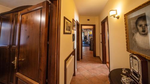 a hallway of a house with a picture of a woman at Villa Lara in Tortorici